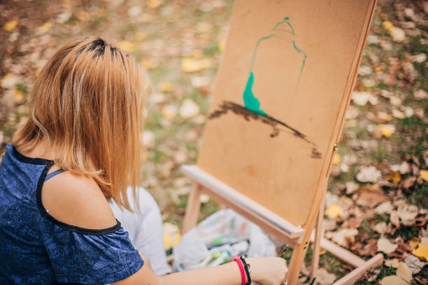 istock One young artist painting 1201436451