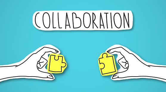 Iconic image of two hands connecting yellow shining puzzles as symbol of cooperation under collaboration lettering, panorama, blue background