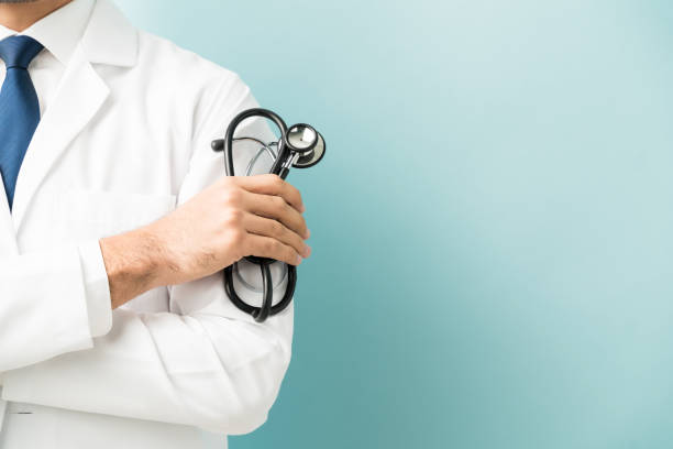 istock Doctor Holding Medical Equipment In Studio 1201438835
