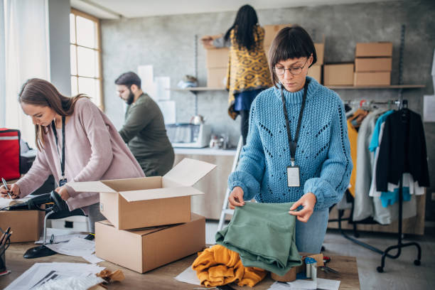 istock Diverse group of people arranging customers orders for drop shipping 1201439152