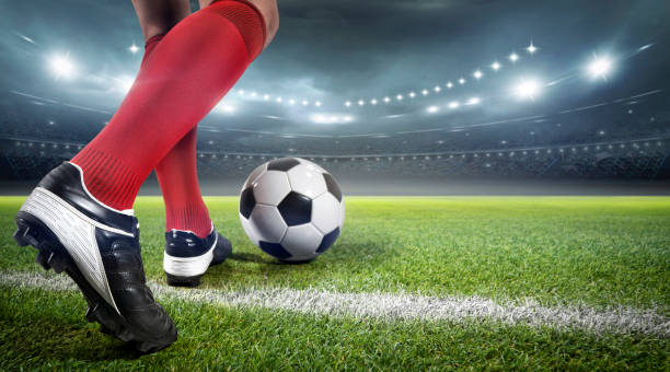 istock Football player with ball 1201439165