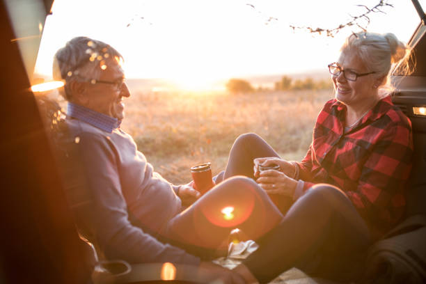 istock Senior couple outdoors with car 1201439731