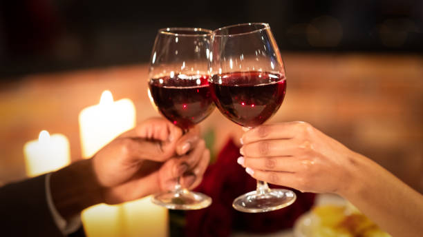 istock Unrecognizable Couple Clinking Glasses Having Date In Restaurant, Cropped, Panorama 1201443341