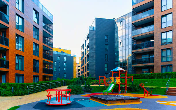 istock Residential apartment building architecture children playground reflex 1201444096