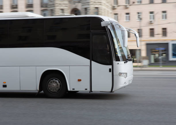 istock bus is moving down the street 1201445751