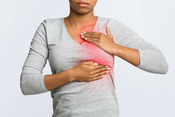 close up of young woman pulping her breast - pulping imagens e fotografias de stock