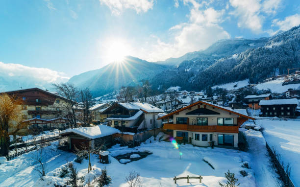 House architecture at Mayrhofen in Zillertal valley Tirol Austria sunny reflex Apartment in residential building exterior. Housing structure at blue modern house of Europe. Rental home in city district on summer. Architecture for business property investment, Mayrhofen Austria. winter village austria tirol stock pictures, royalty-free photos & images