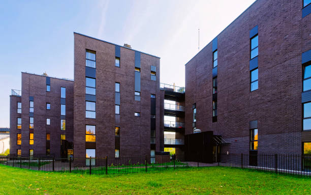 istock Modern glass architecture of apartment house reflex 1201448162