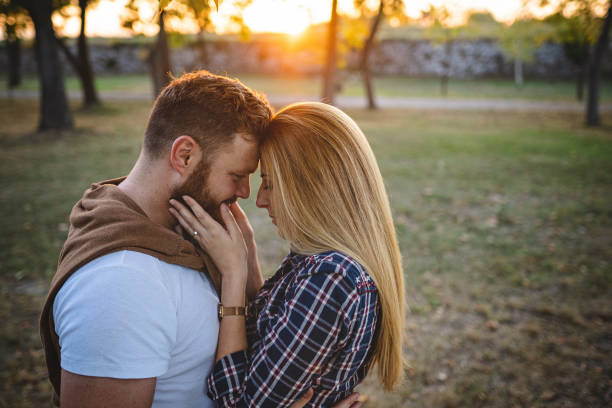 istock Beautiful romantic couple in sunset 1201448690