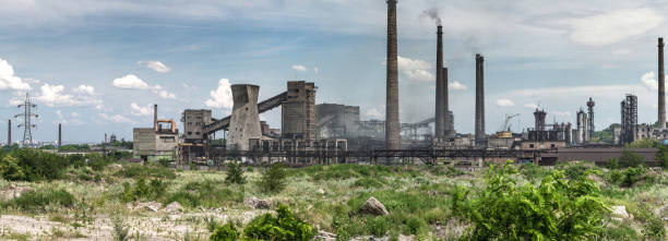 the largest air pollutant in city dnipro ukraine is coke-chemical plant. flue gas stacks emit hundreds tons of harmful substances a years into the atmosphere. industrial panoramic landscape. - flue gas imagens e fotografias de stock