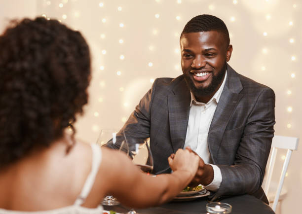 istock Happy black guy courting his woman, having date 1201448976