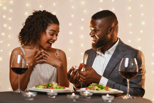 istock Man making marriage proposal to his surprised woman 1201449666