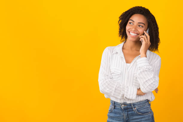 istock Happy afro model talking on mobile phone 1201450461