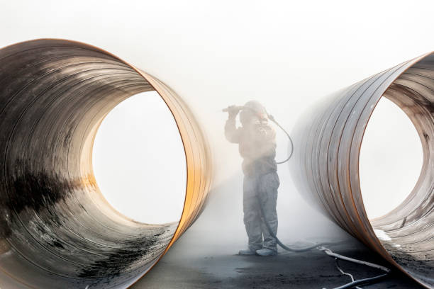 istock The sandblaster is sandblasting to the pipe materials. A sandblasting system includes four basic components: the air source, the sandblasting cabinet, the dust collector, and the blasting media. 1201452851