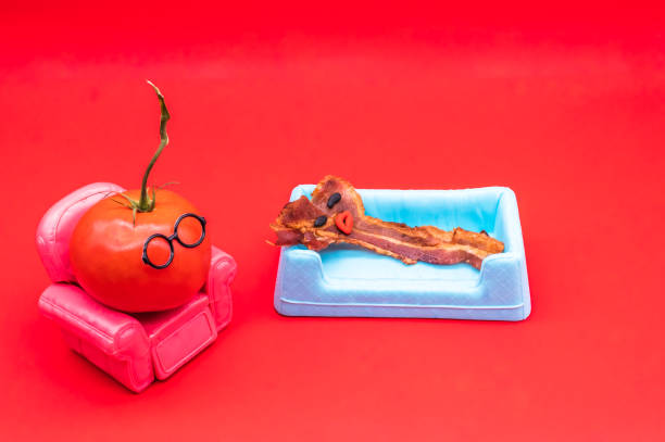 Brunch therapy. Funny anthropomorphic bacon and tomatoe in a therapy session
