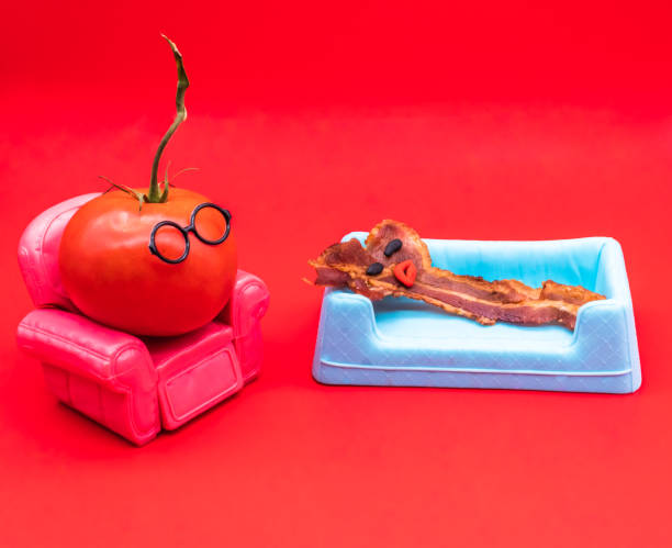 istock Brunch therapy. Funny anthropomorphic bacon and tomatoe in a therapy session 1201454710