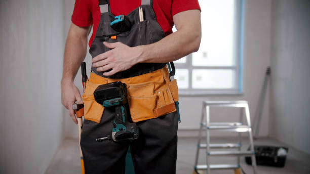istock A young fit man worker wearing a tool belt 1201455019