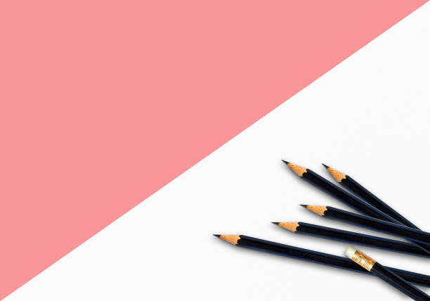 istock Black pencils placed on color paper background with copy space for your image or text. 1201455418