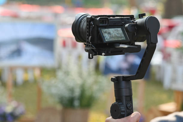 istock The photographer Video camera operator on stabilizers working with his equipment to pay close attention to take a photo. 1201456830