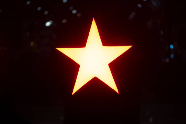 istock A glowing star lamp in the darkness 1201458610