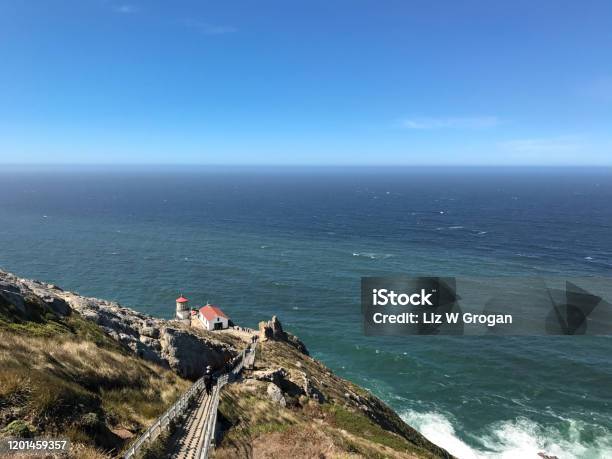 Steep Stairs Lead Down A Rocky Path To The Point Reyes Lighthouse With The Pacific Ocean In The Background In Northern California Landscape Stock Photo - Download Image Now