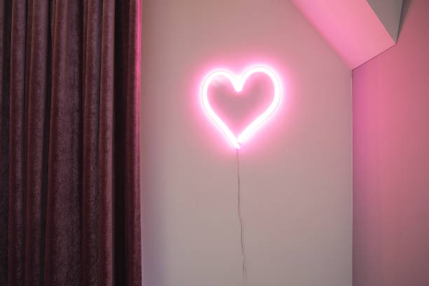 istock Pink Heart neon light on wall in a modern interior, retro design Valentines concept 1201460802