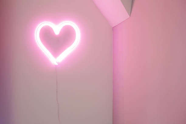 istock Pink Heart neon light on wall in a modern interior, retro design Valentines concept 1201460832