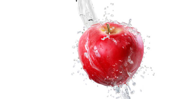 istock Apples in splash of water isolated on white background 1201461224