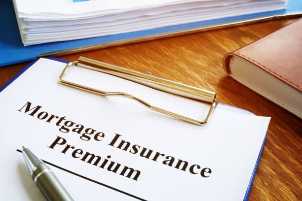 istock Mortgage Insurance Premium MIP with stack of documents. 1201461260