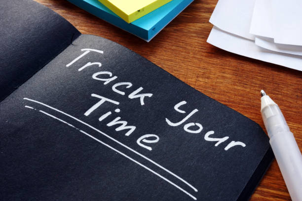 istock Time management concept. Track Your Time phrase handwritten on the black sheet. 1201461371