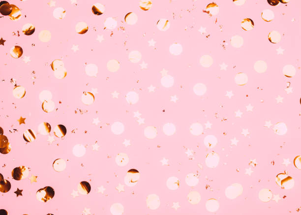 istock Pink confetti and stars and sparkles on pink background. 1201464652