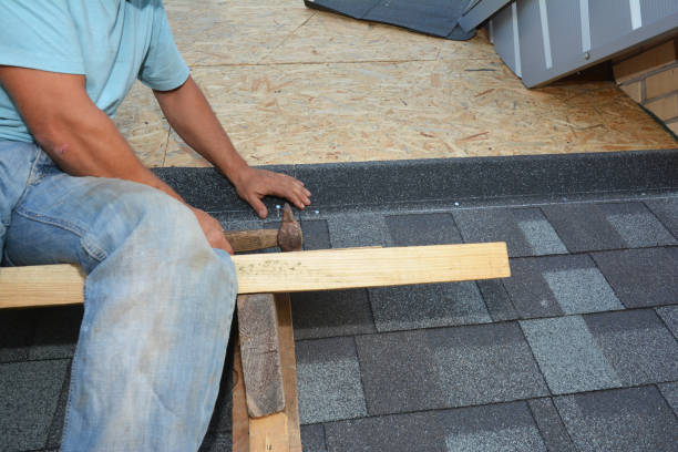 istock Roofing contractor installing asphalt shingles on osb board house roof. Roofing construction 1201465933