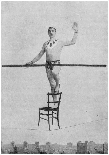 ilustraciones, imágenes clip art, dibujos animados e iconos de stock de foto antigua: acróbata caminante de cuerda - tightrope walking circus skill