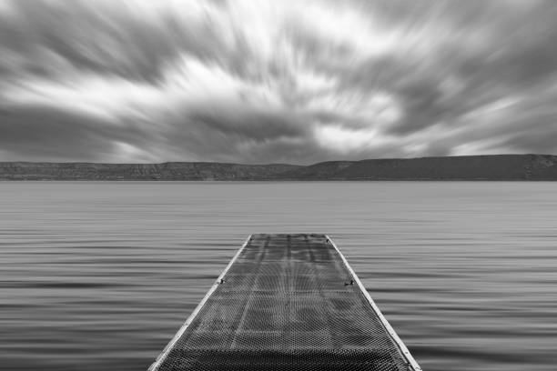 istock Boat slip and dramatic clouds on the Green River, Wyoming 1201469234