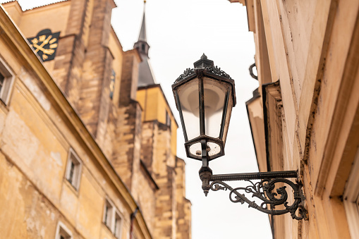 The architecture of the old city of Prague. Retro gothic street lamp for street lighting. Photo in the afternoon