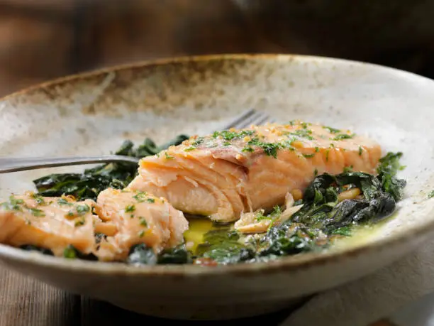 Lemon, Garlic and Butter Poached Salmon with Swiss Chard and Toasted Pine nuts