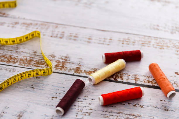 istock colorful sewing and tailoring tools and items on light background 1201473718