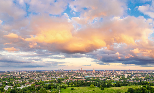 A wide angle panoramic aerial view of London, photographed in summer from the north of the city.