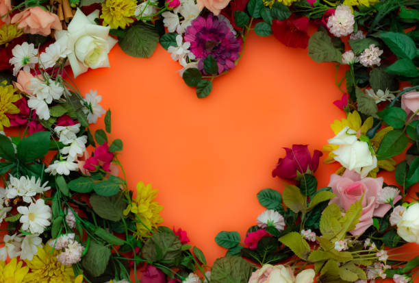 istock a heart shaped letter frame made by colorful replica flowers for valentine's day 1201479634