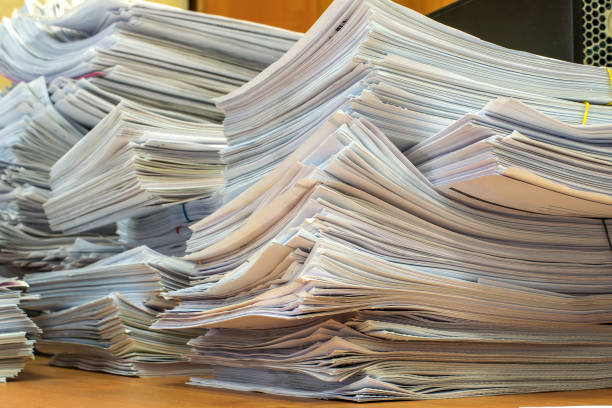 istock pile of paper documents in the office 1201480175