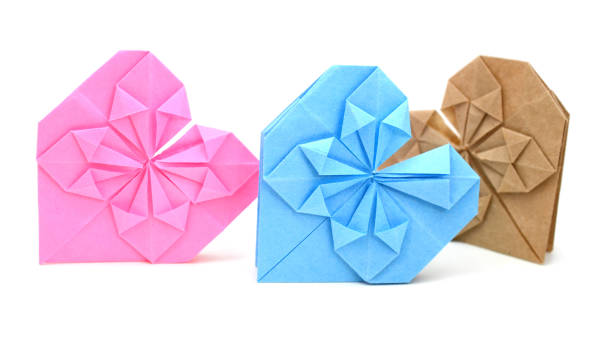 istock A set of folded colorful origami hearts on white 1201481392