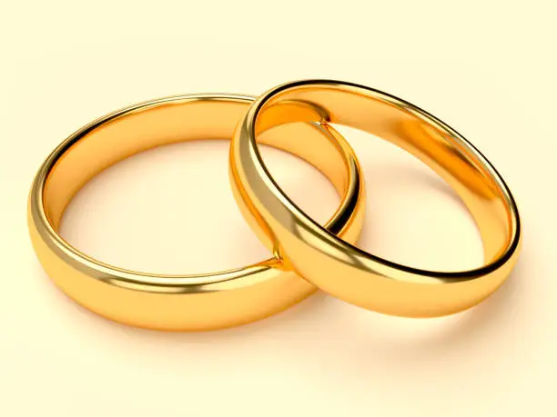 Two wedding gold rings lie on each other. 3d rendering