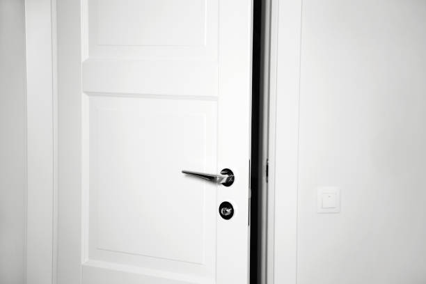 istock Modern white door. Minimalist bright interior 1201485419