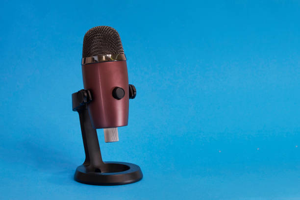 modern microphone on the blue background, isolated on blue