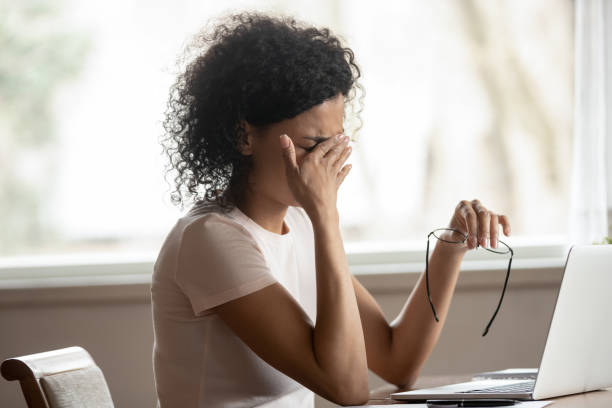 istock Tired biracial woman take off glasses suffer from blurry vision 1201492873