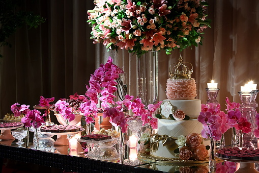 decoration elements, dishes, sweets, cakes for 15 years party in pink