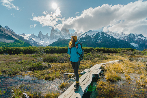 Young Caucasian woman hiking near  Fitz Roy mountain in Patagonia