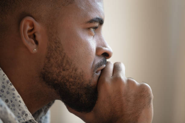 istock Close up of pensive biracial man thinking having problem 1201494890
