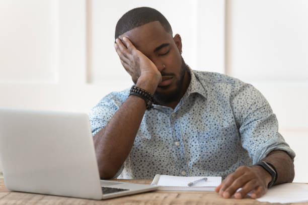 istock Tired african American fall asleep studying at laptop 1201494910