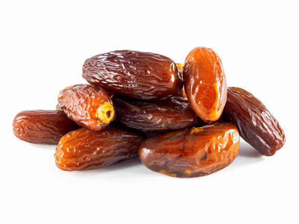 istock Dried fruit dates on a white background. Dried date palm fruit 1201495051